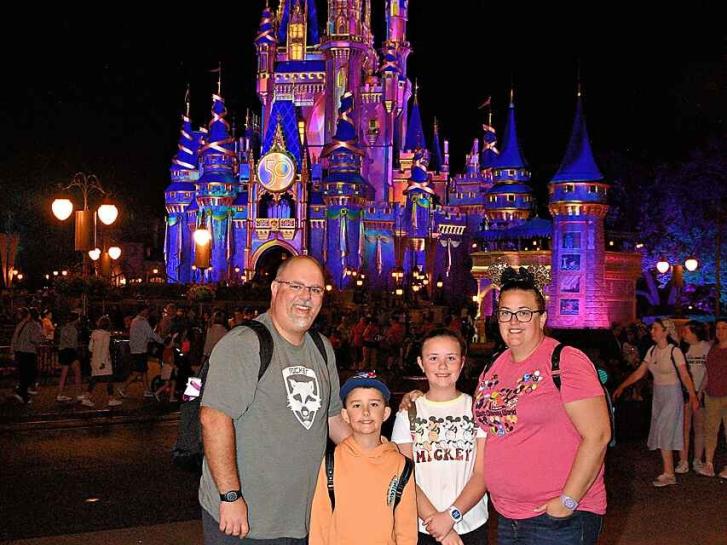 Guest Photo from Autumn Taylor: Guests in front of Cinderella Castle at Magic Kingdom at night