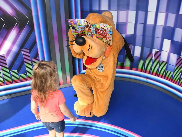 Guest Photo from Laura: Guest with Pluto at Walt Disney World