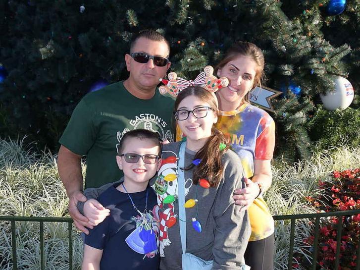 Guest Photo from Cangeros Christmas: Guests in front of Christmas Tree at Epcot