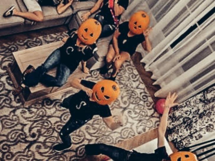 Guest Photo from Tracie Zalasky: Guests in Jack O' Lantern masks in their room at Disney's Saratoga Springs Resort